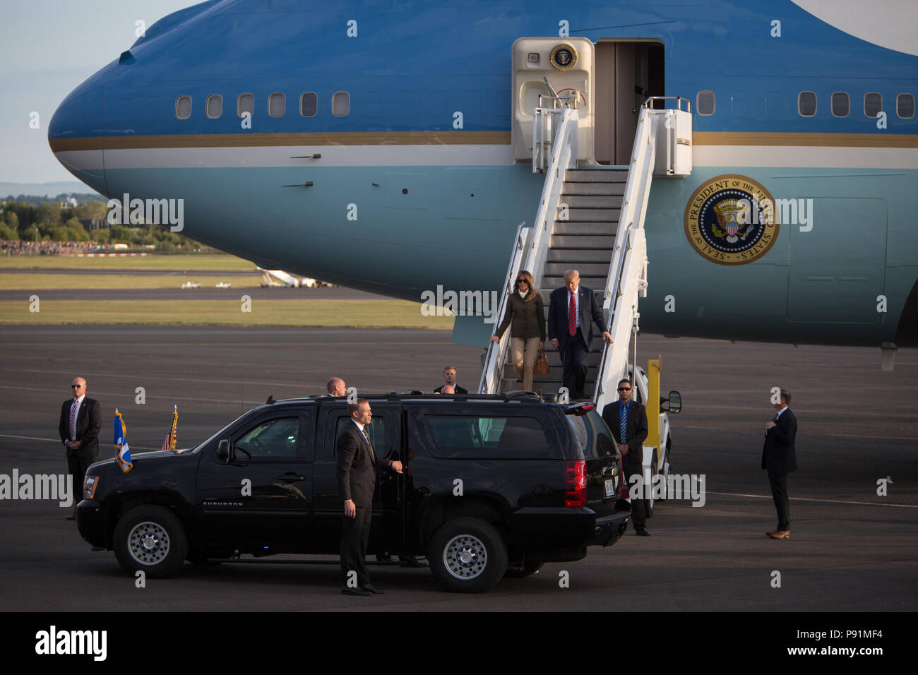 Prestwick, Scotland, on 13 July 2018. President Donald Trump, and wife Melania, arrive on Air Force One at Glasgow Prestwick International Airport at the start of a two day trip to Scotland. Image Credit: Jeremy Sutton-Hibbert/ Alamy News. Stock Photo