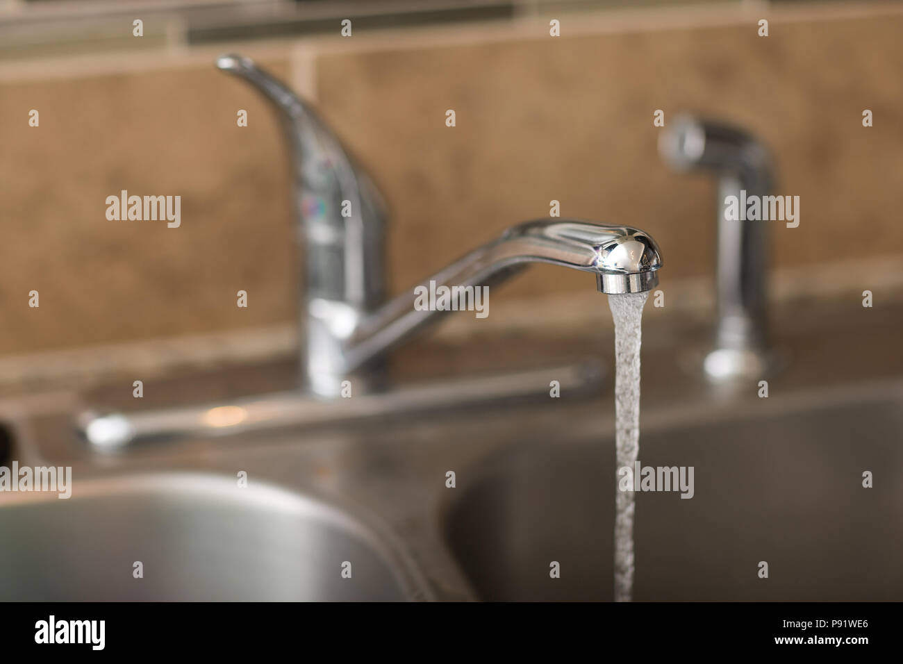 Water Coming Out Of A Faucet View Is A 3 4 View With Shallow