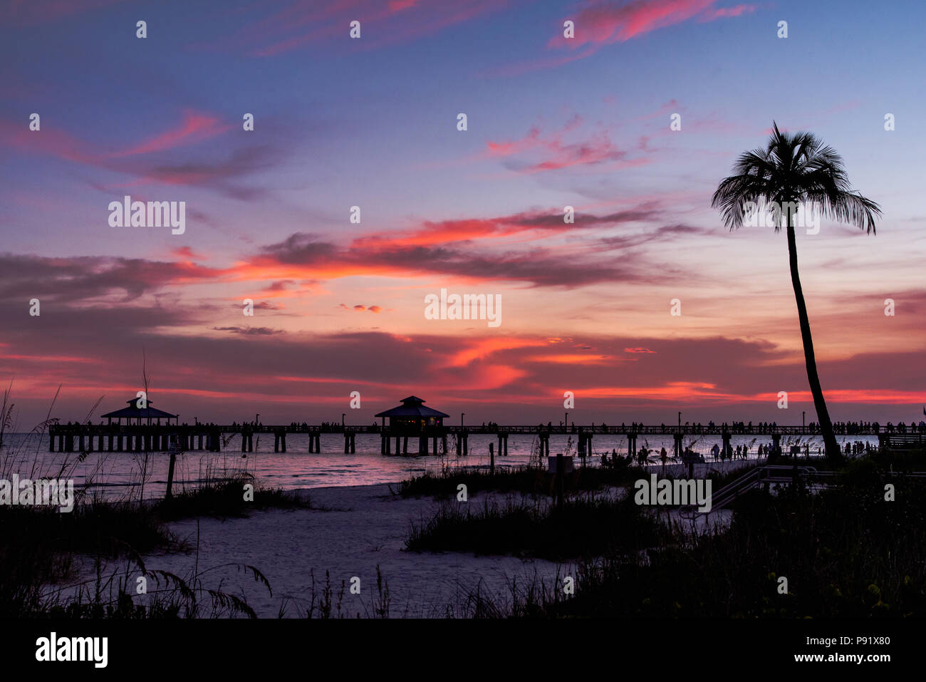 Fort Myers Pier and beach during a sunset. Stock Photo