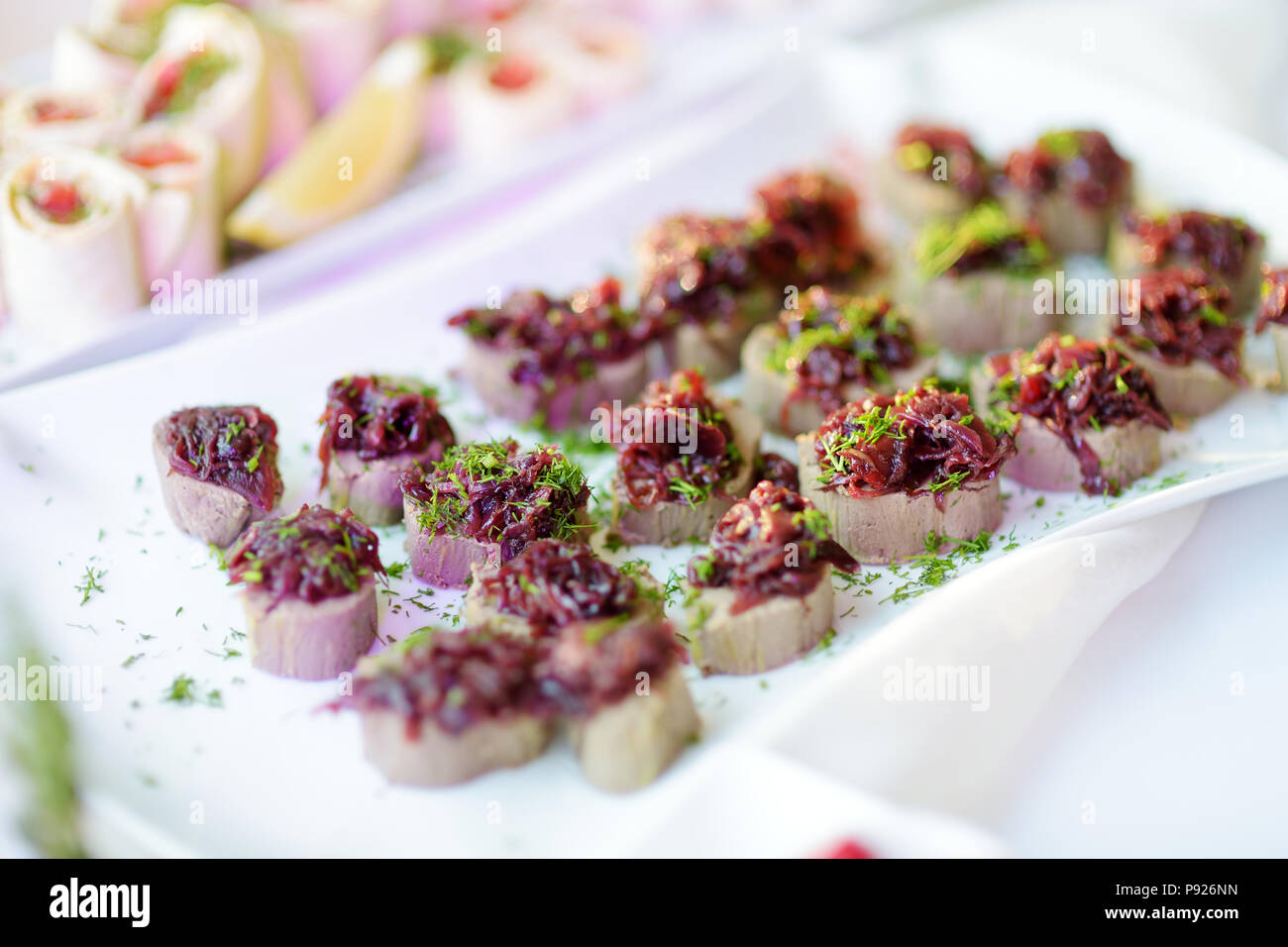 Delicious pate snacks with beet topping served on a party or wedding ...