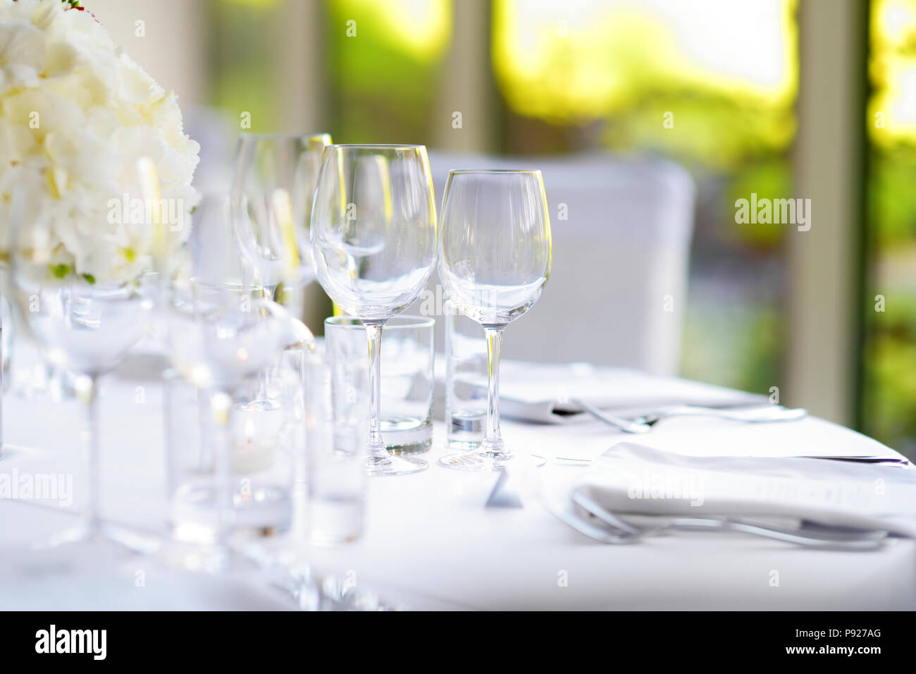Beautiful table setting with crockery and flowers for a party, wedding