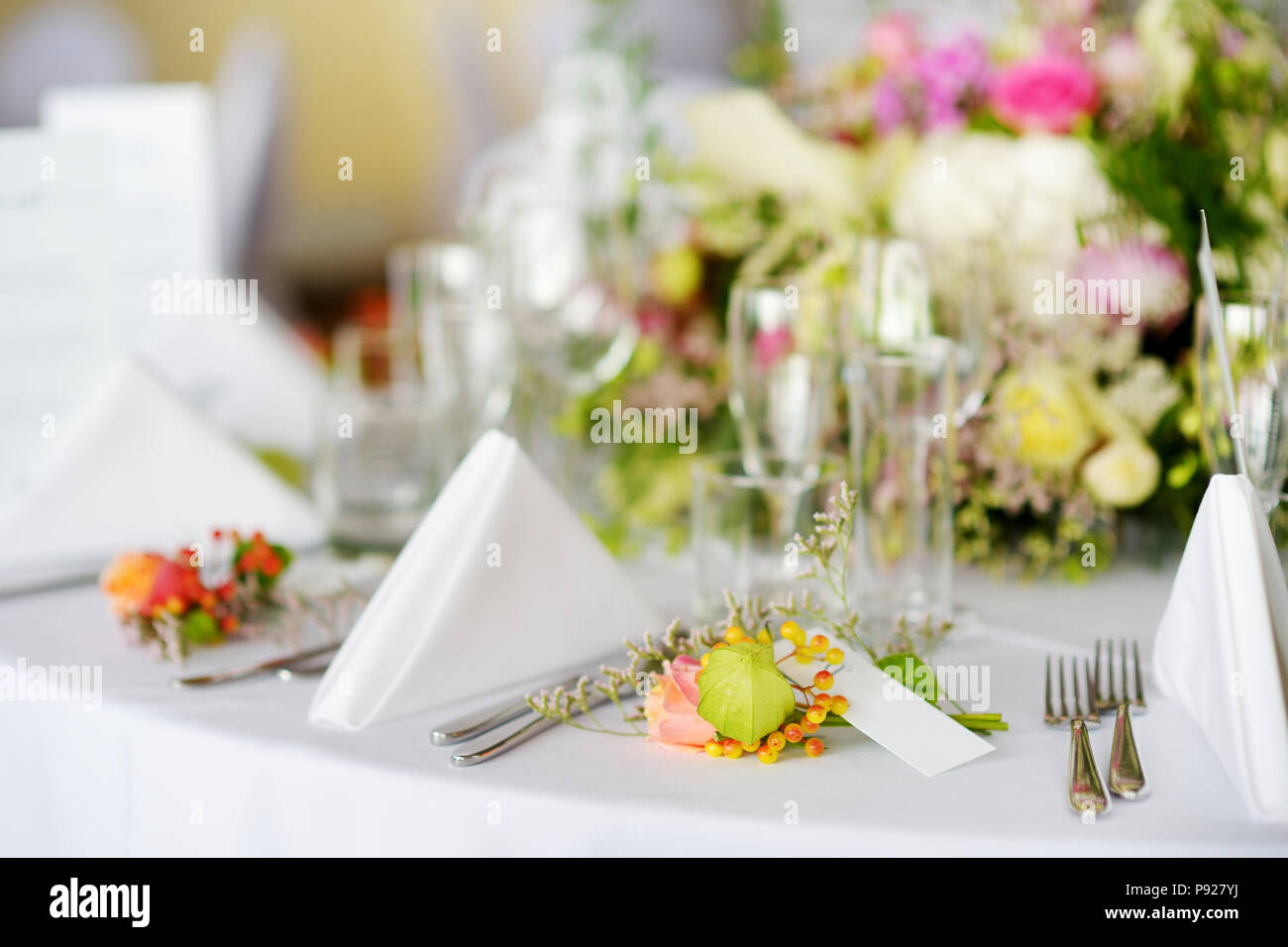 Beautiful table setting with crockery and flowers for a party, wedding