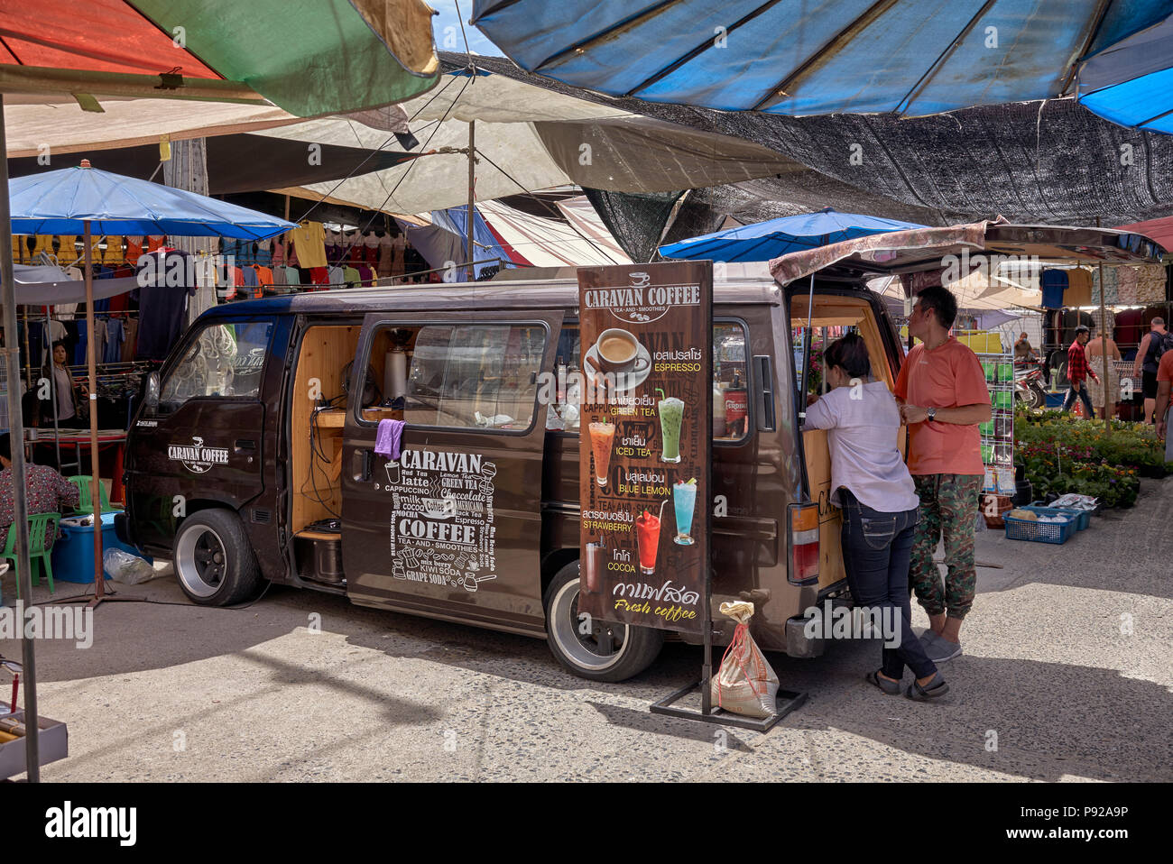 Volkswagen dormobile converted and utilised  as a  mobile coffee shop. Thailand street market, Southeast Asia Stock Photo