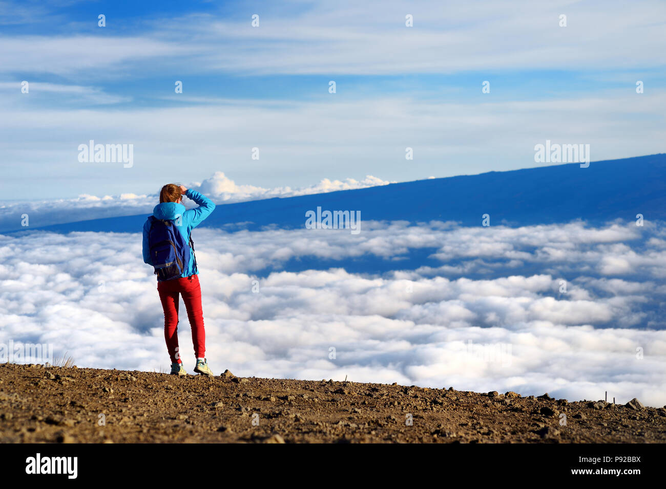 Tourist admiring breathtaking views from the Mauna Kea, a dormant