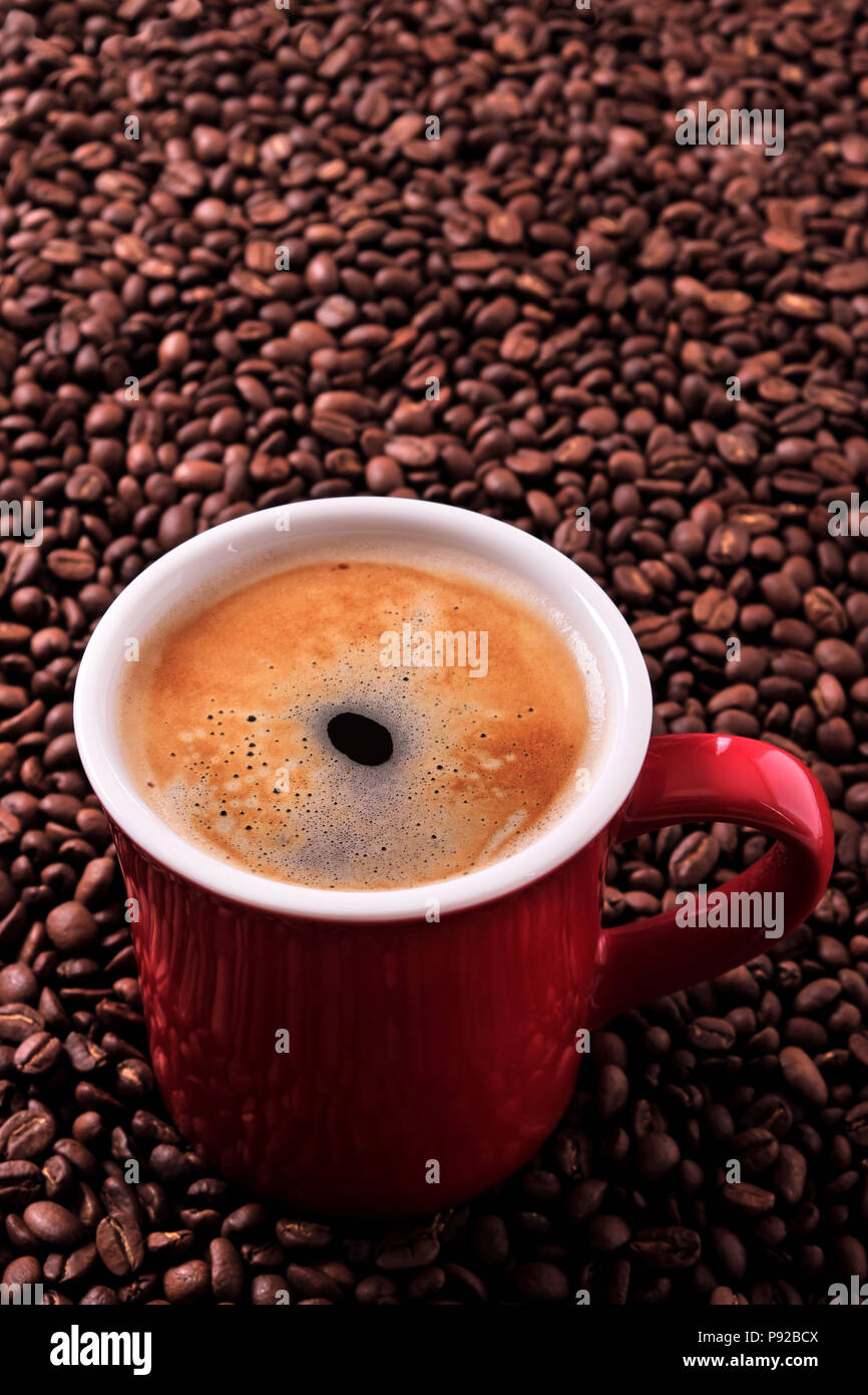 Red coffee mug americano beans background vertical Stock Photo