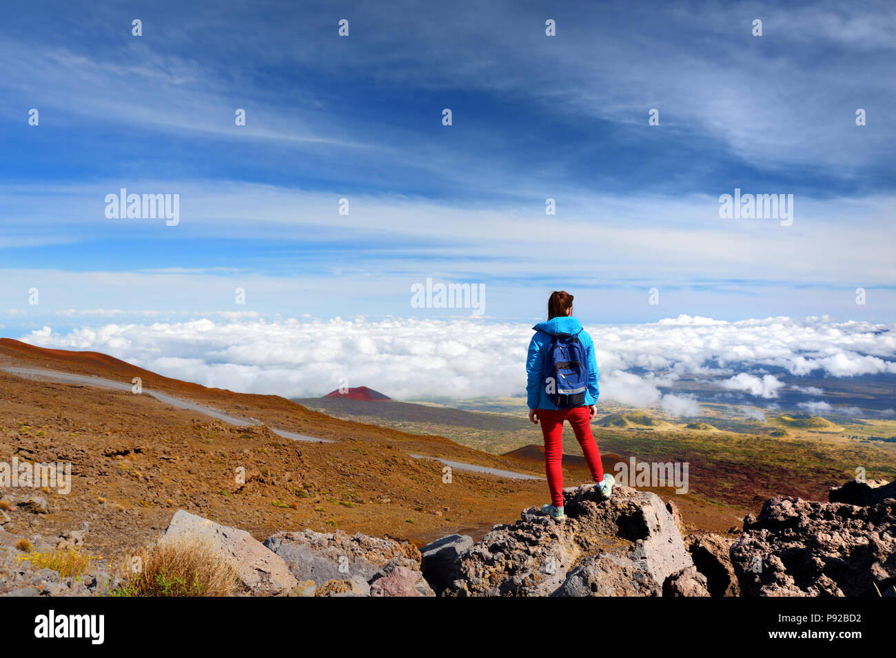 Tourist admiring breathtaking views from the Mauna Kea, a dormant