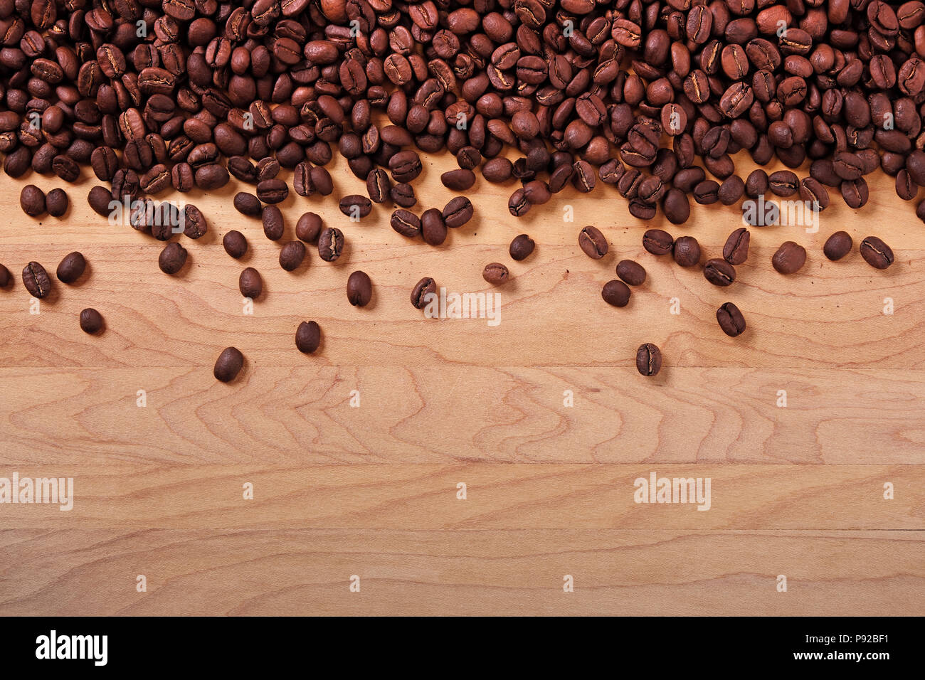 Coffee beans wood background border Stock Photo