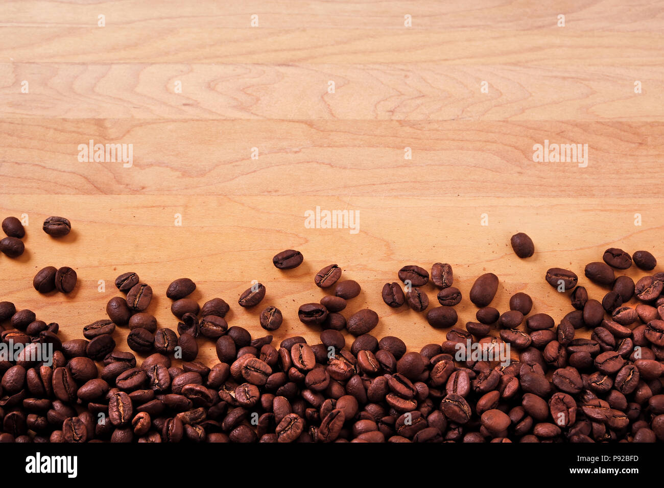 Coffee beans wood background border Stock Photo