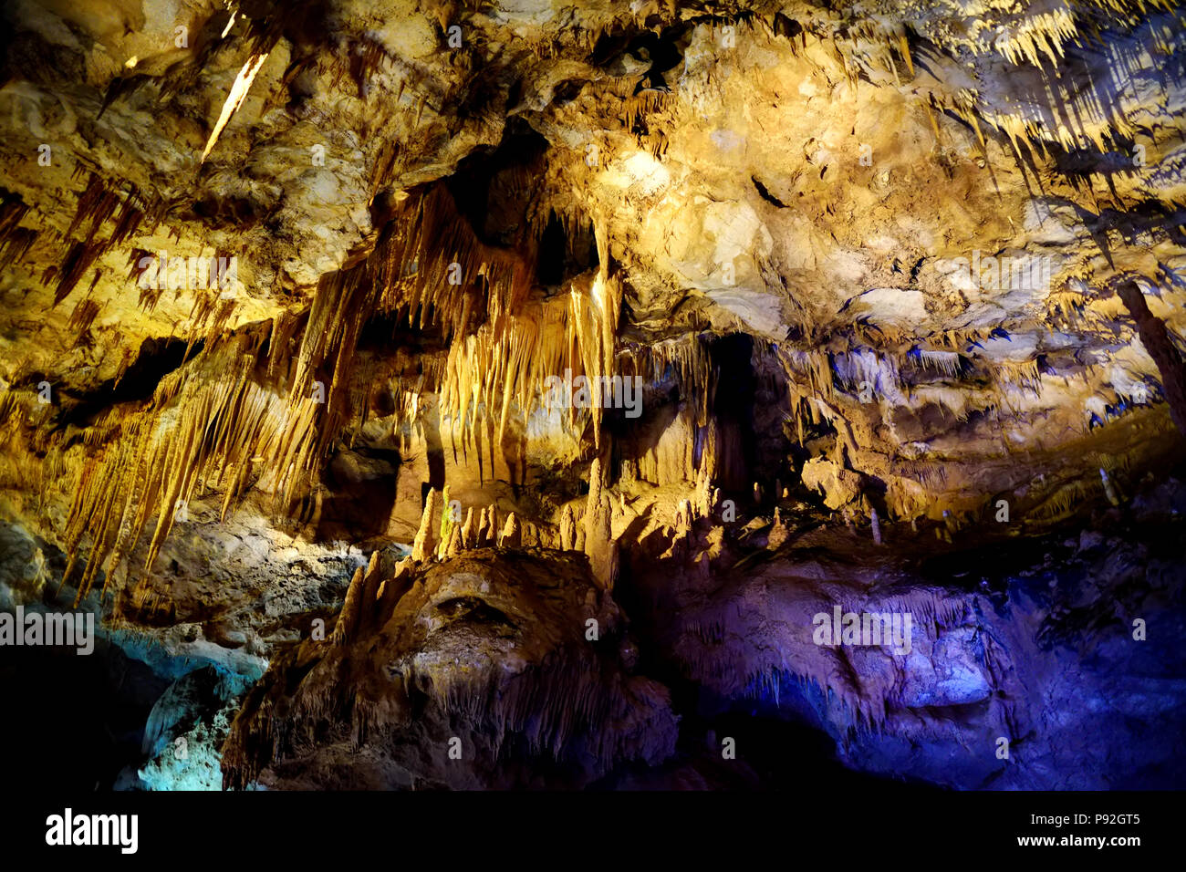 Insides of Kumistavi cave, known as Prometheus cave, one of Georgia's natural wonders full of stalactites, stalagmites, curtains, petrified waterfalls Stock Photo