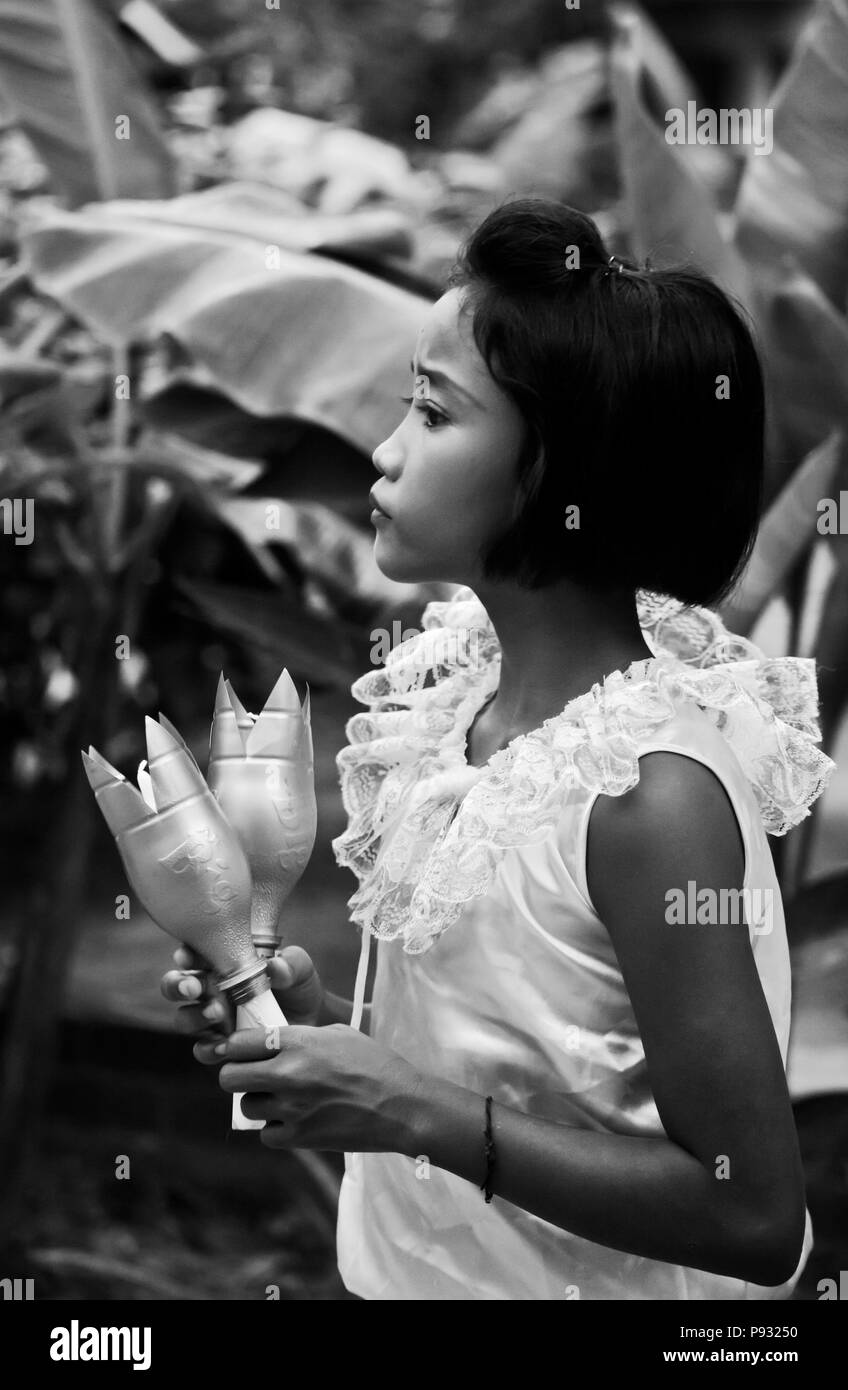A Thai girl dresses up for a traditional dance during the  LOI KRATHONG FESTIVAL at the HOME AND LIFE ORPHANAGE in PHANGNGA  - KHAO LOK, THAILAND Stock Photo