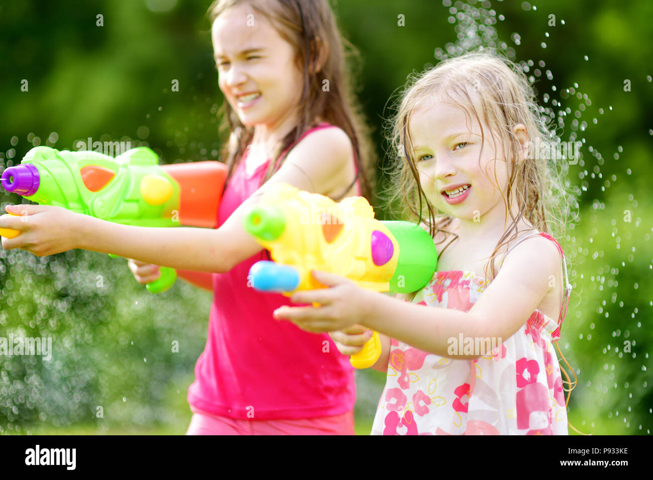 Adorable Little Girl Playing with Water Gun on Hot Summer Day. Cute Child  Having Fun with Water Outdoors Stock Photo - Image of leisure, beautiful:  97180460