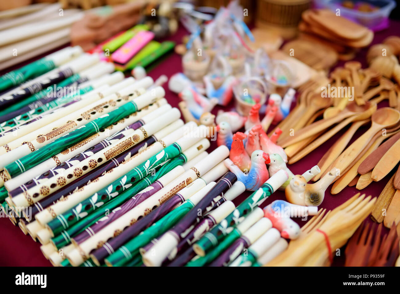 Ceramic whistles and wooden pipes sold on Easter market in Vilnius. Lithuanian capital's annual traditional crafts fair is held every March on Old Tow Stock Photo