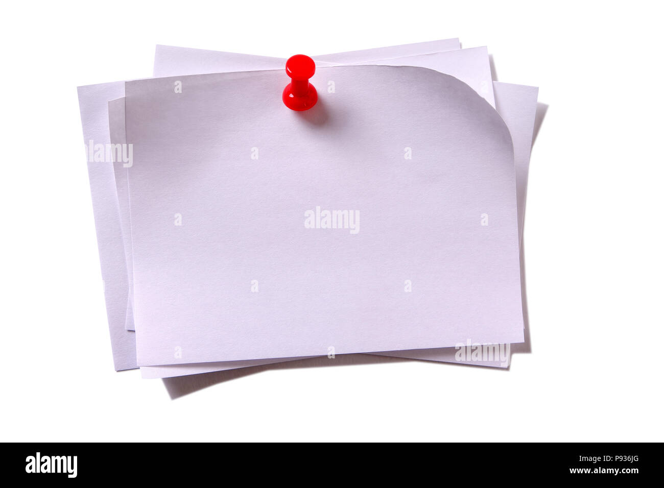 Several plain white sticky post notes with red pushpin Stock Photo