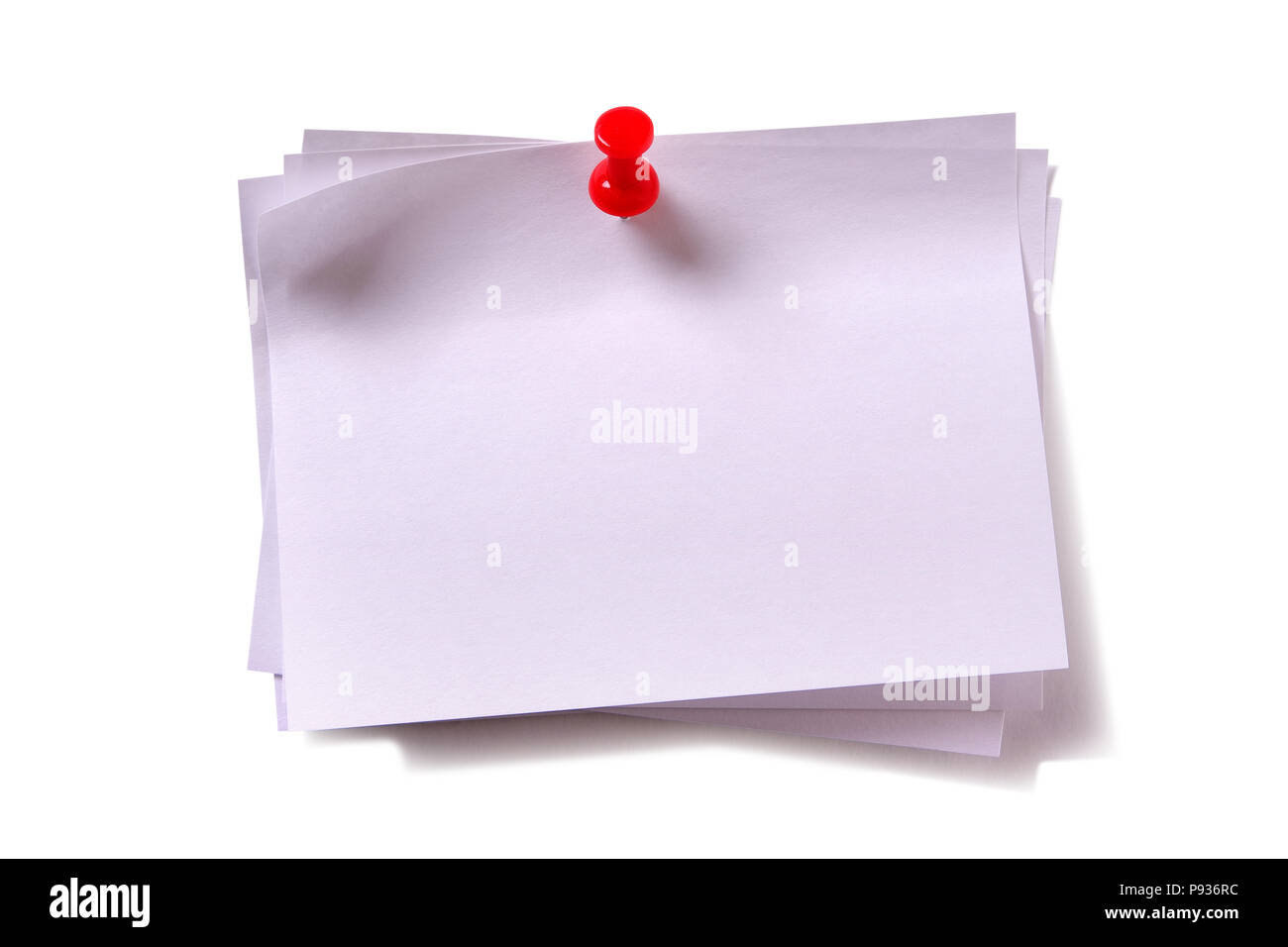 Several plain white sticky post notes with red pushpin Stock Photo