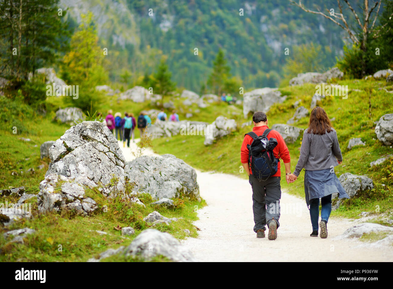Tourists On A Hiking Trails Around Picturesque Konigssee Known As tourists-on-a-hiking-trails-around-picturesque-konigssee-known-as
