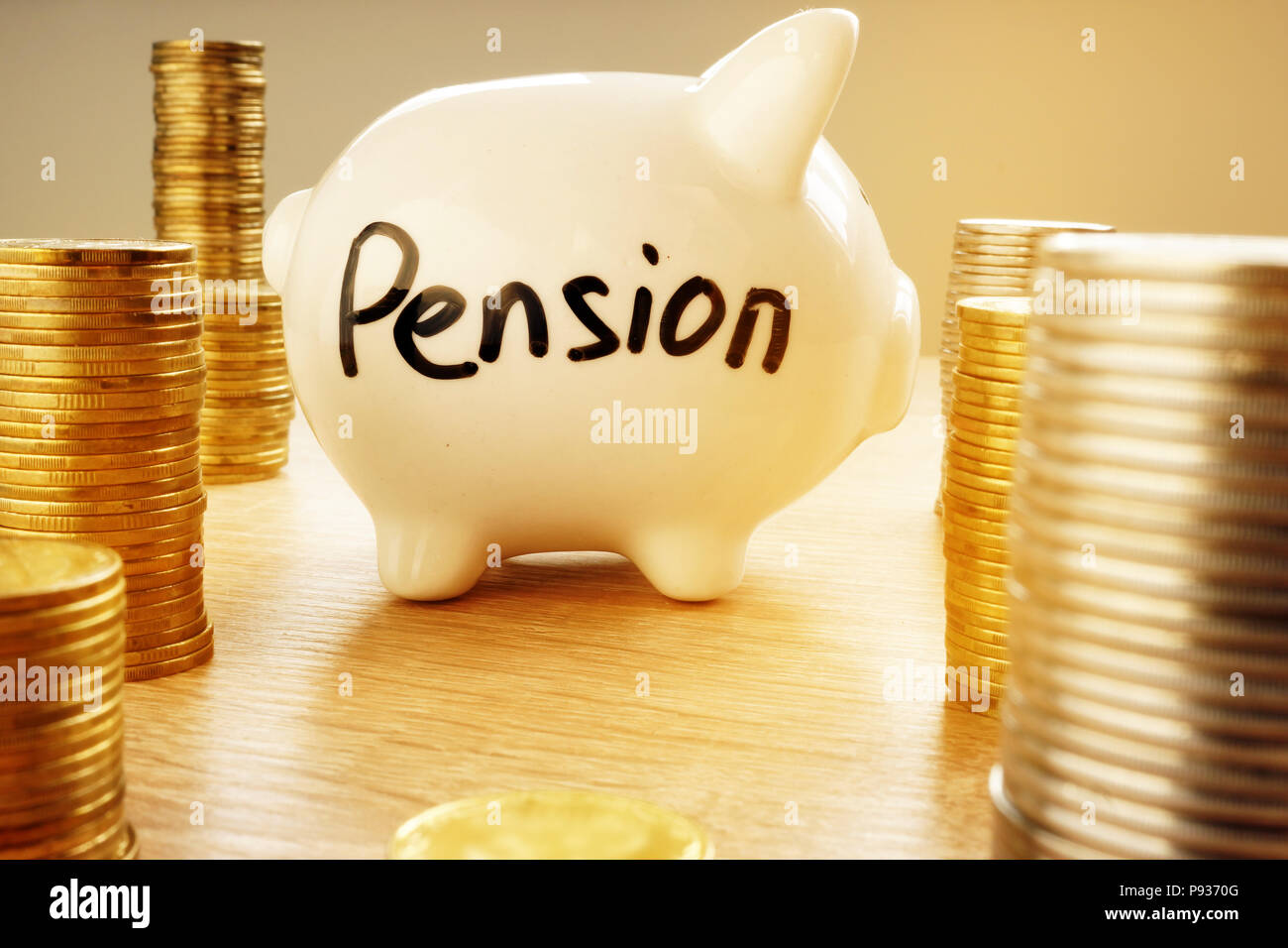 Retirement plan. Piggy bank with word pension. Stock Photo