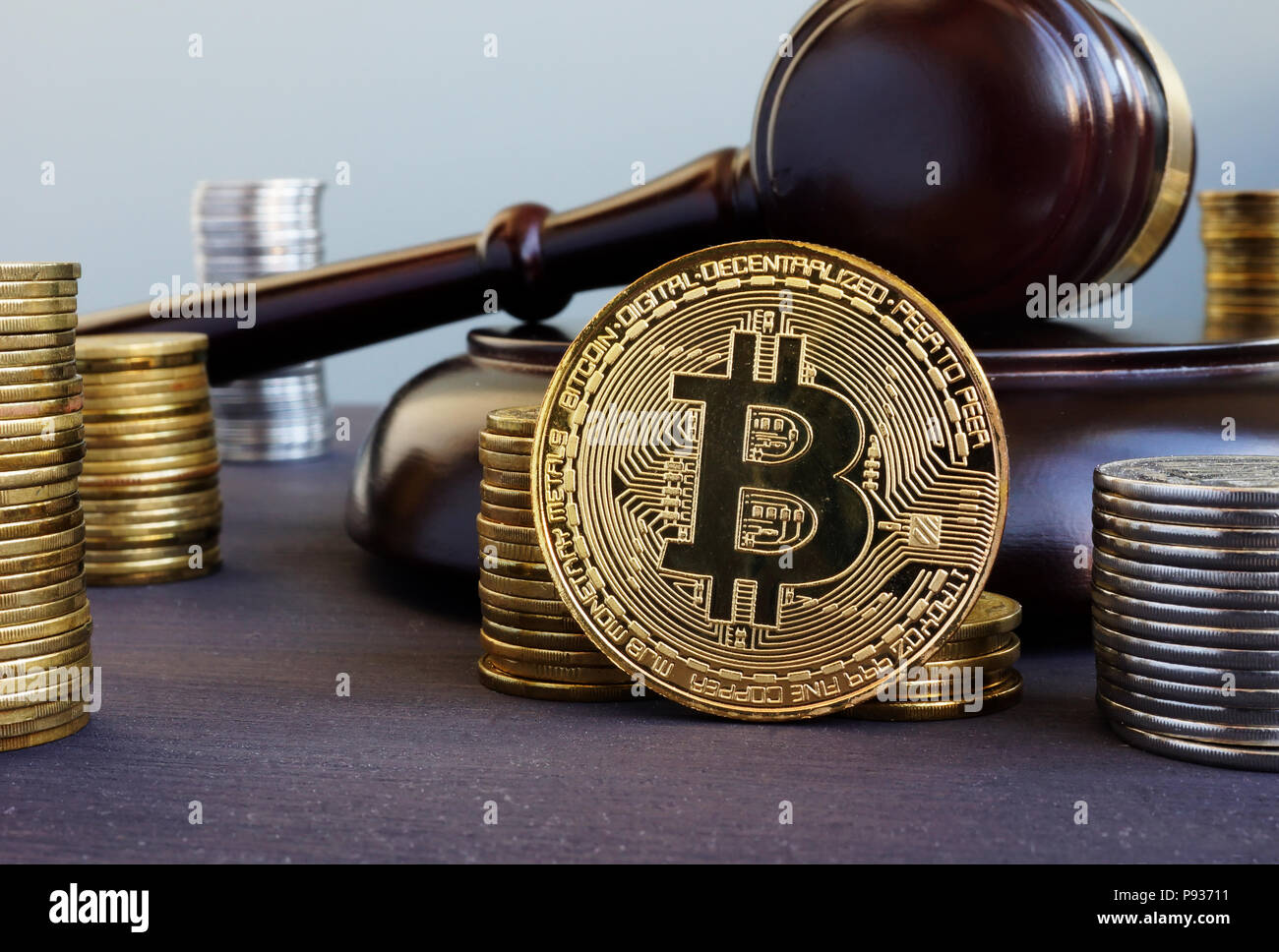 Cryptocurrency regulation. Bitcoin and gavel on a desk. Stock Photo