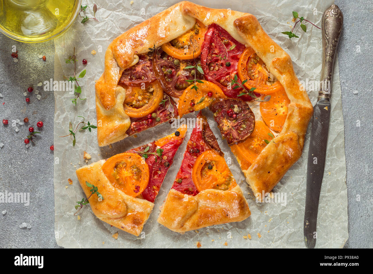 Delicious Galette with goat cheese, colorful tomatoes, thyme and spices
