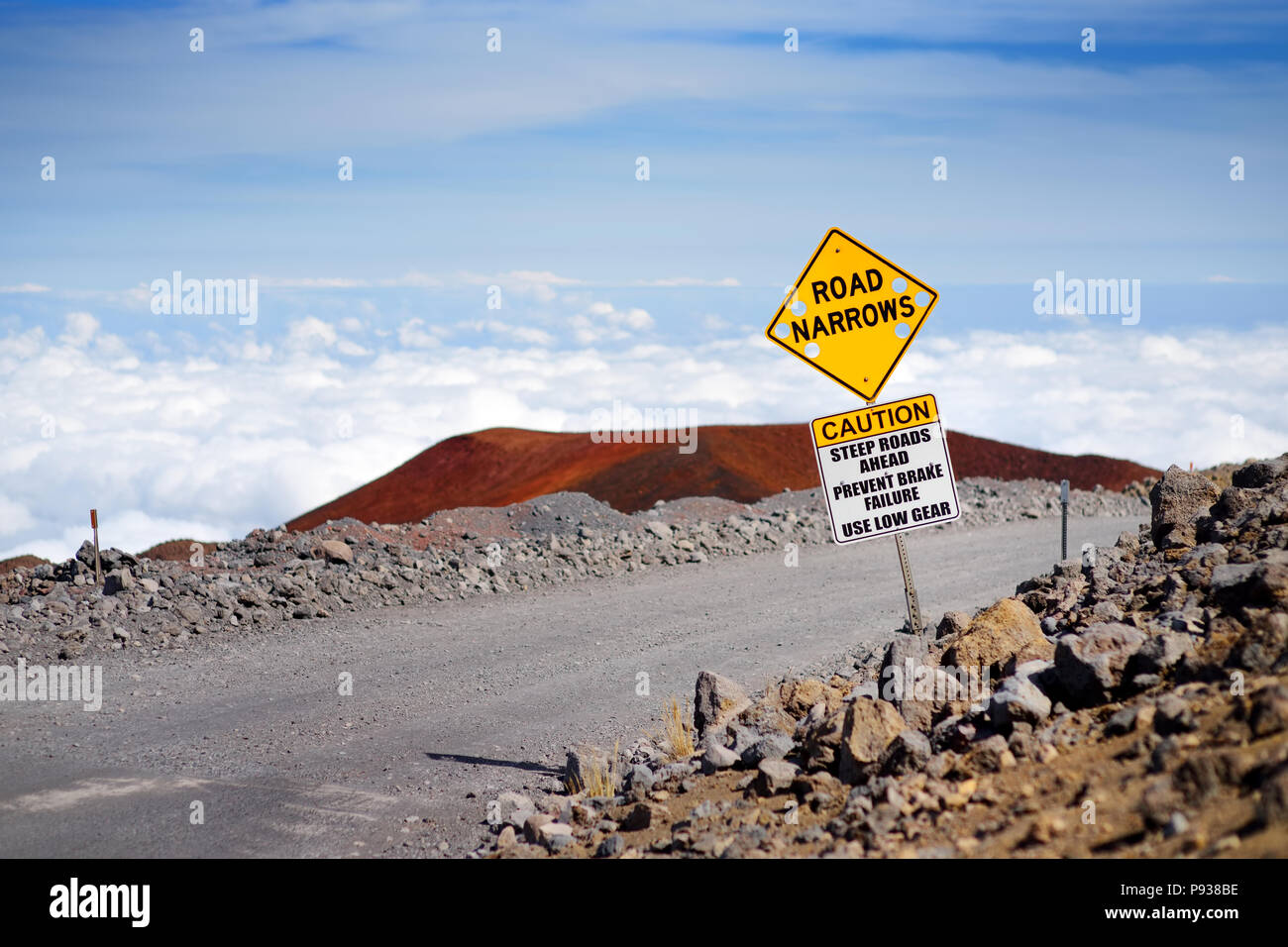 A road sign on a steep road to the summit of Mauna Kea, a dormant