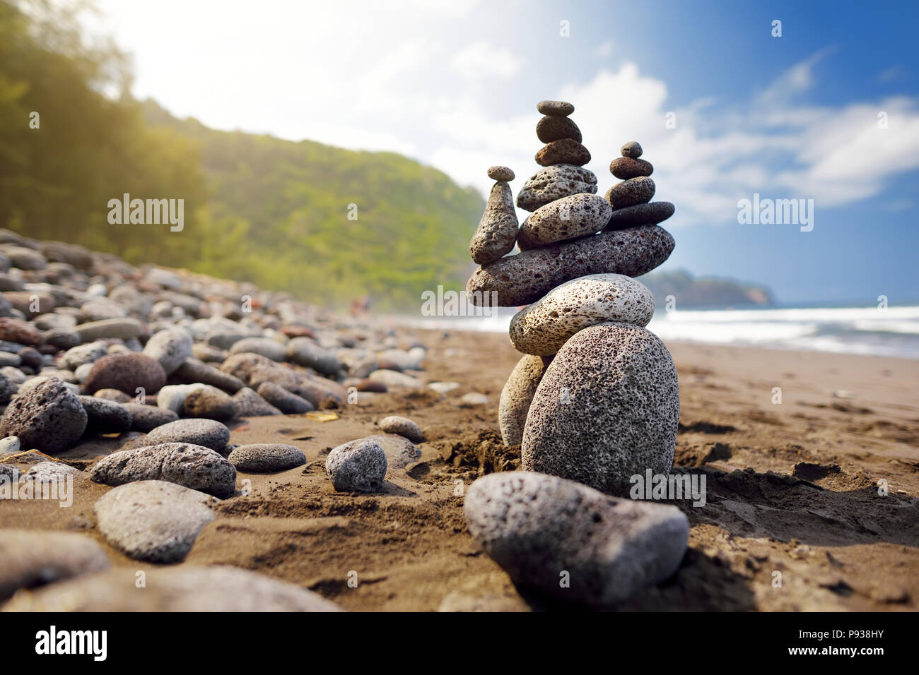 Stack of stones balanced on rocky beach of Pololu Valley, Big Island ...