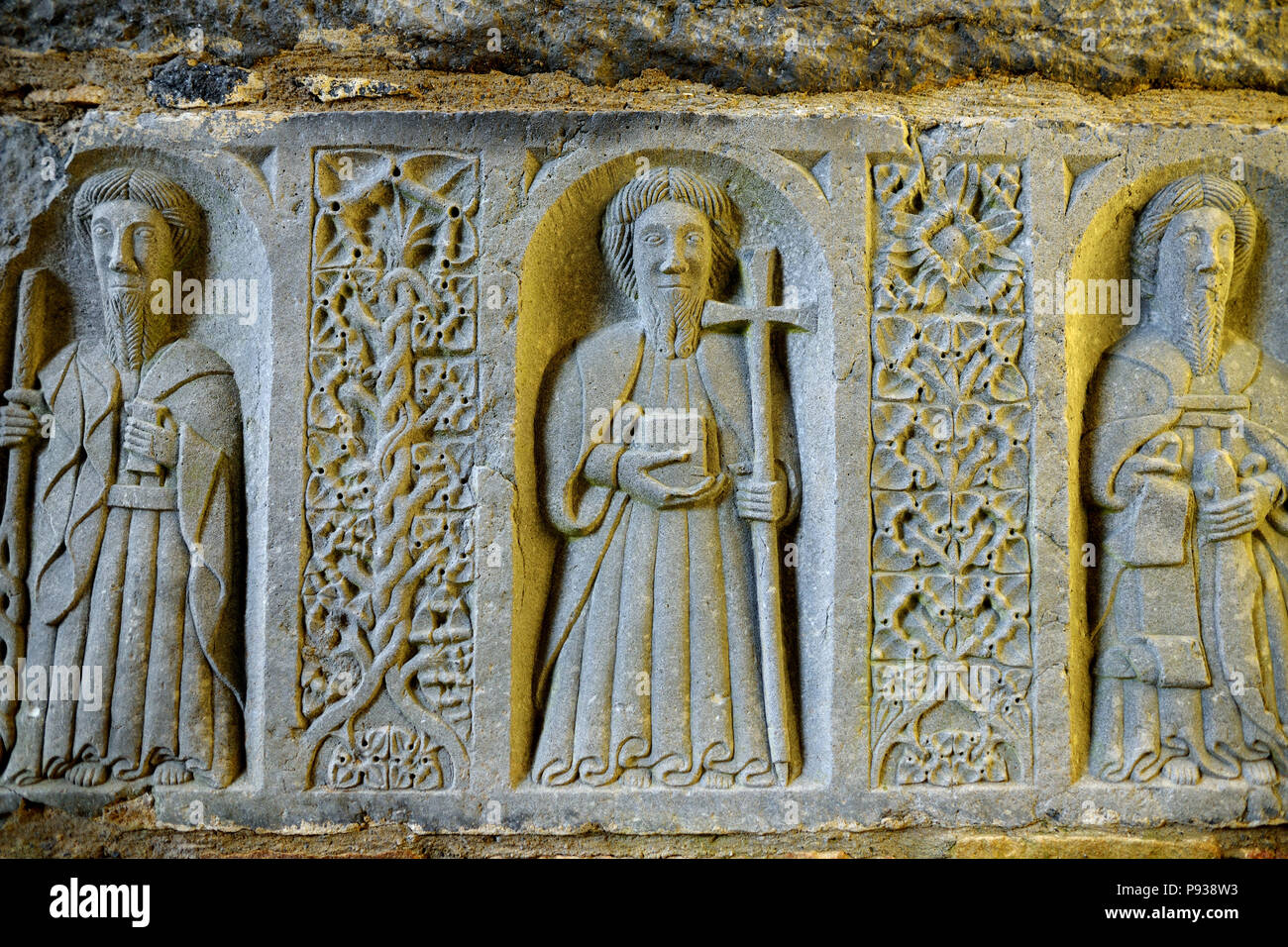 Monks and ornaments carved in stone in a ruined Jerpoint Abbey, located
