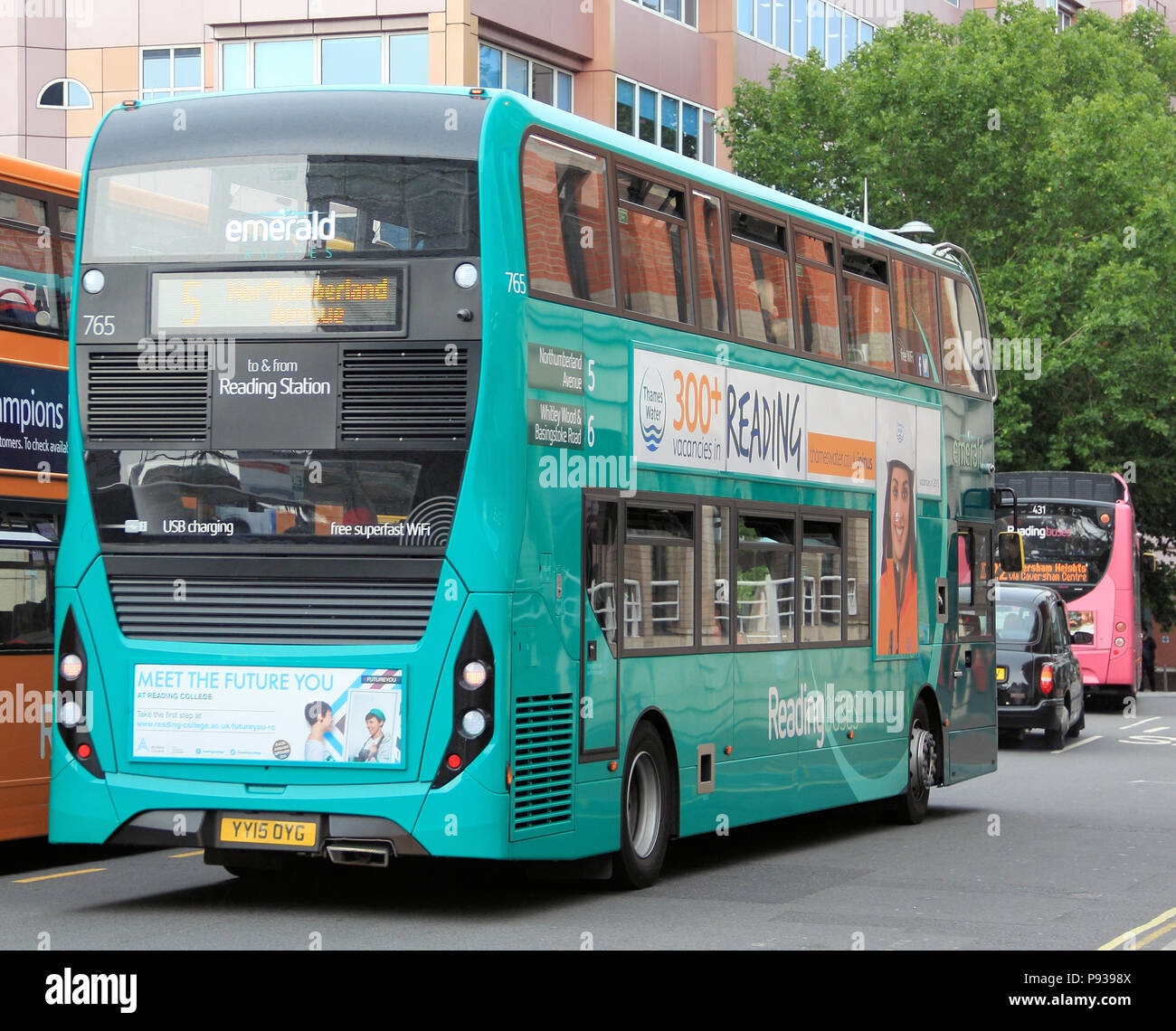 The buses of Reading are colour coded by their route., the colours include; Emerald, Claret, Sky blue, Jet black, yellow, orange, pink and more.... Stock Photo