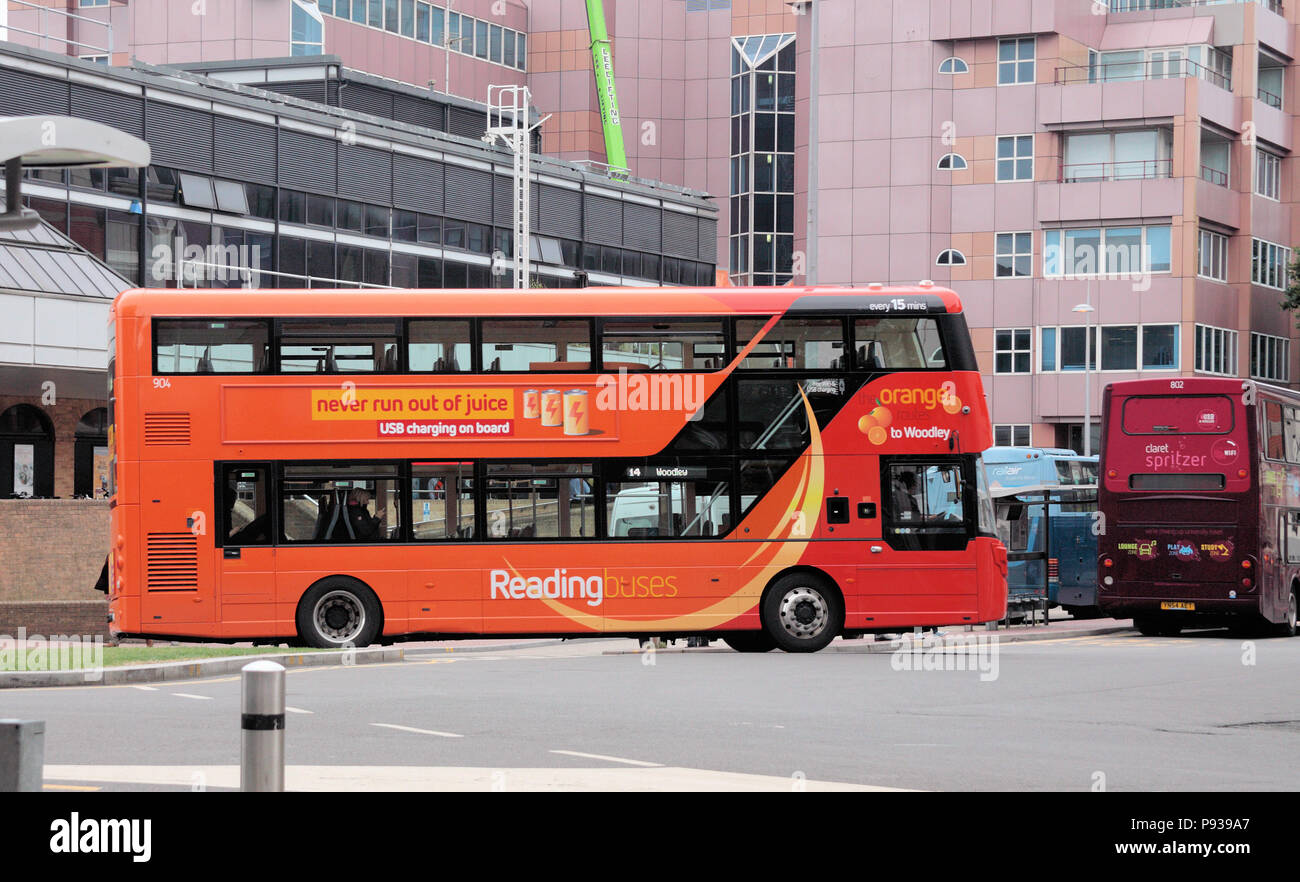 Reading buses are coloured just like their route on a route map. Colours include; pink, emerald, orange, yellow, jet back, claret, sky blue and more.. Stock Photo