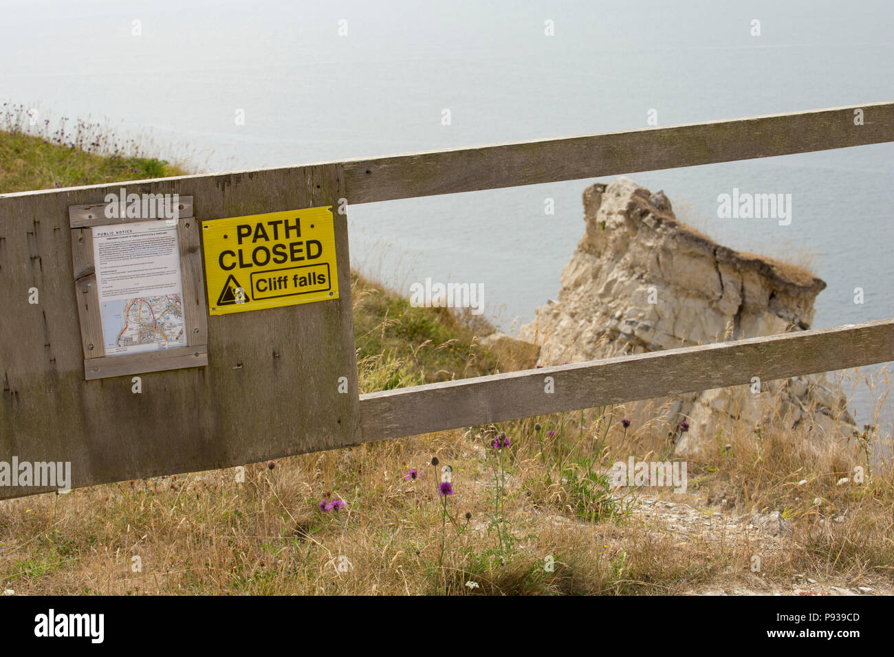Views of the coastal path that runs around the clifftops of the Isle of Portland on its western side. In this case the path has been closed and divert Stock Photo