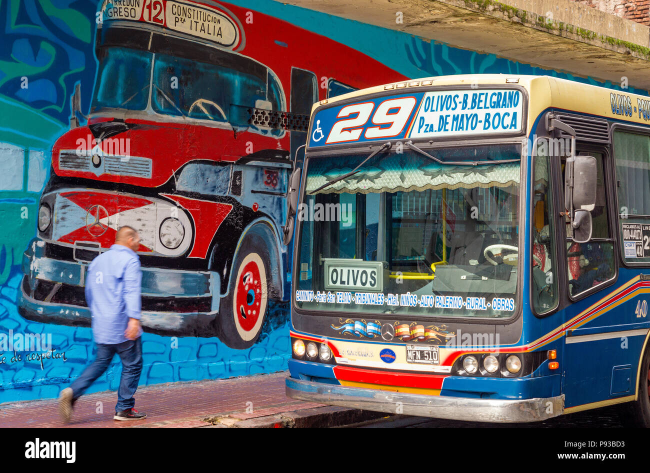 Street art and public bus with driver at San Telmo, Buenos Aires Stock Photo