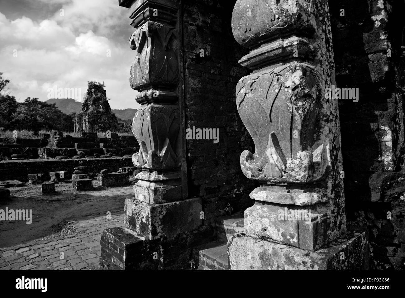 Ancient STONE PILLARS inside the 2nd CENTURY MY SON RUINS near the village of TAM KY, VIETNAM Stock Photo