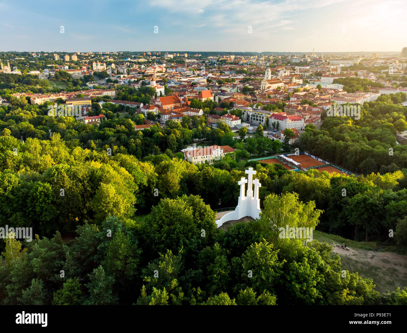 Aerial view of the Three Crosses monument overlooking Vilnius Old Town on sunset. Vilnius landscape from the Hill of Three Crosses, located in Kalnai  Stock Photo