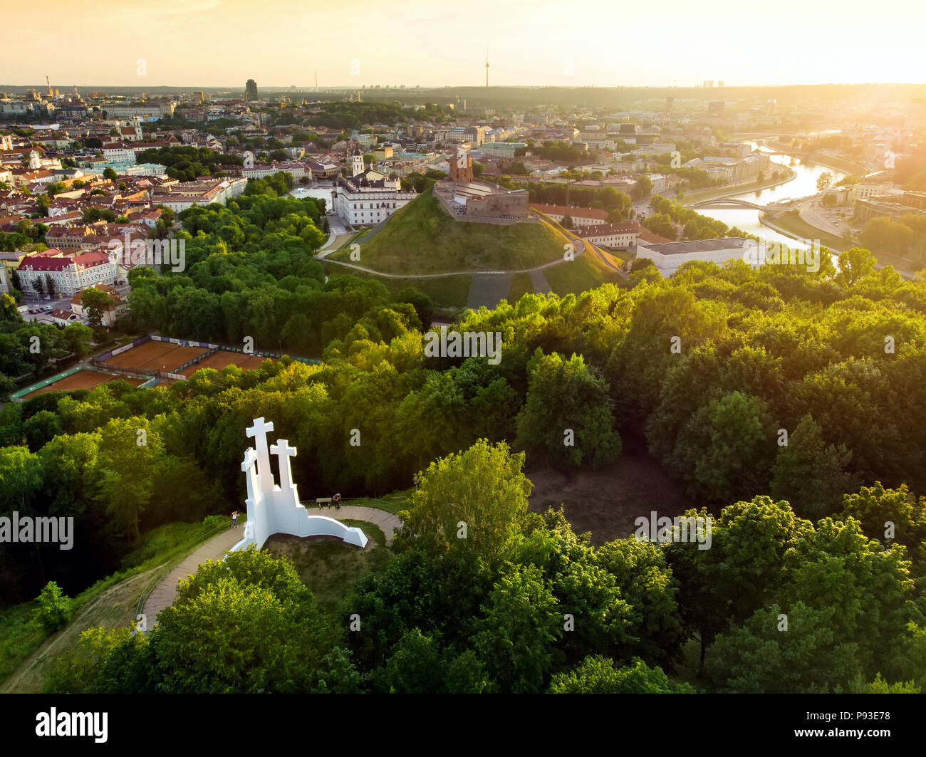 Aerial view of the Three Crosses monument overlooking Vilnius Old Town on sunset. Vilnius landscape from the Hill of Three Crosses, located in Kalnai  Stock Photo