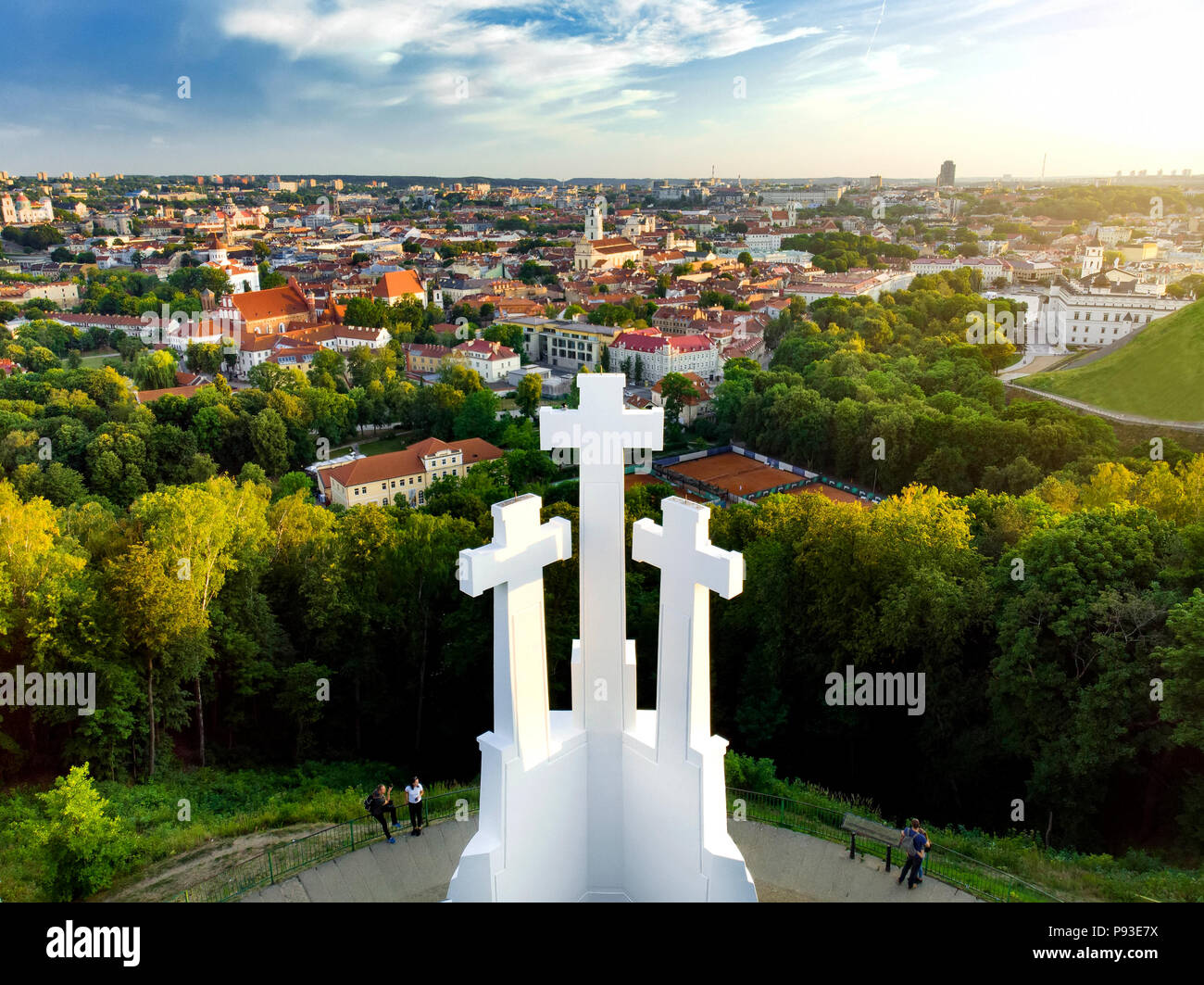Aerial view of the Three Crosses monument overlooking Vilnius Old Town on sunset. Vilnius landscape from the Hill of Three Crosses, located in Kalnai  Stock Photo