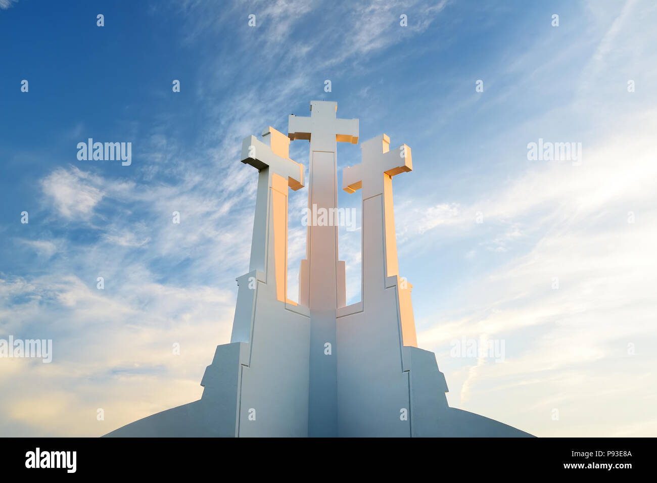 The Three Crosses monument overlooking Vilnius Old Town on sunset. Vilnius landscape from the Hill of Three Crosses, located in Kalnai Park, Lithuania Stock Photo