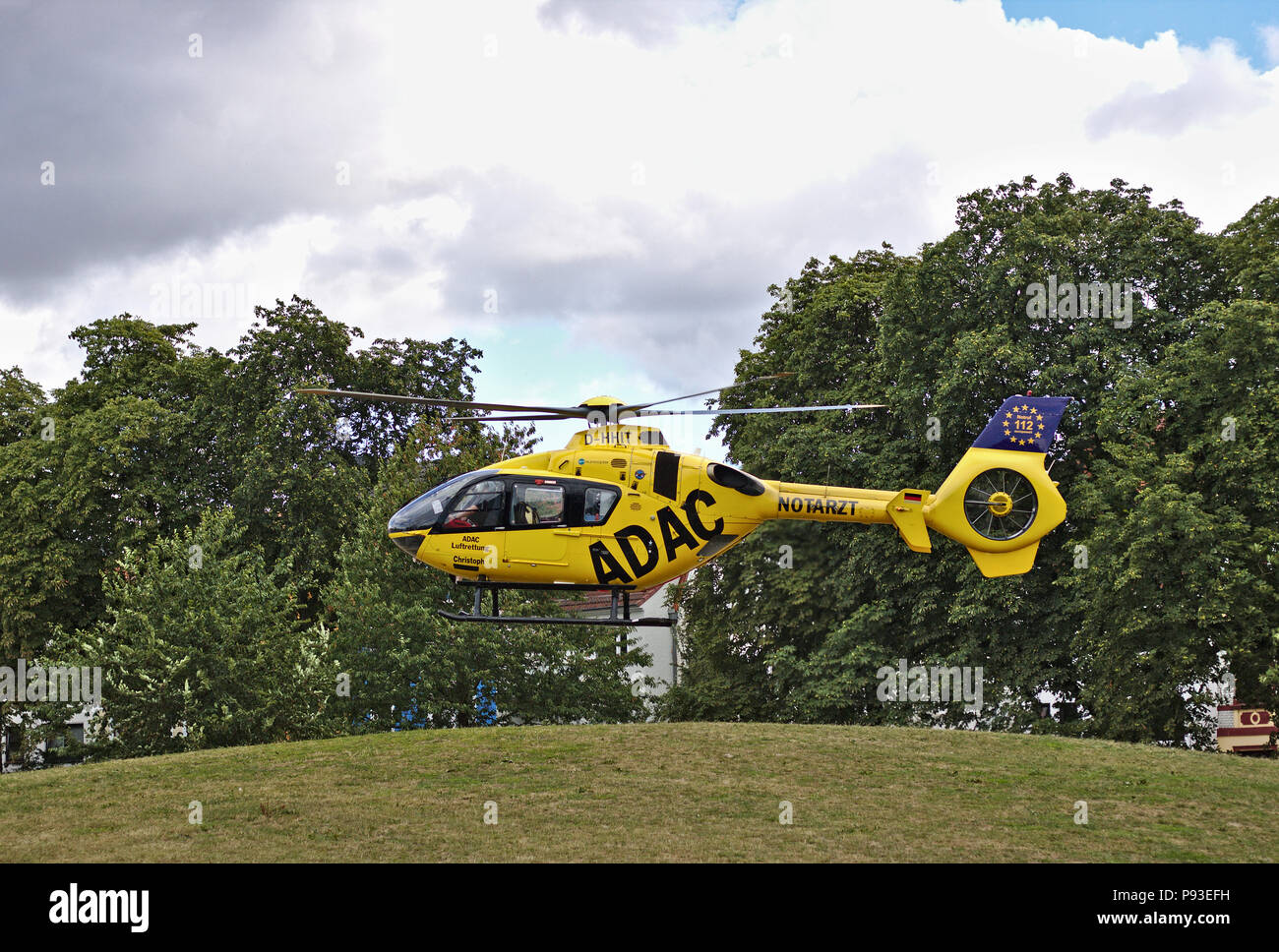 Bremen, Germany - July 10th, 2018 - Emergency rescue helicopter taking off in a park Stock Photo