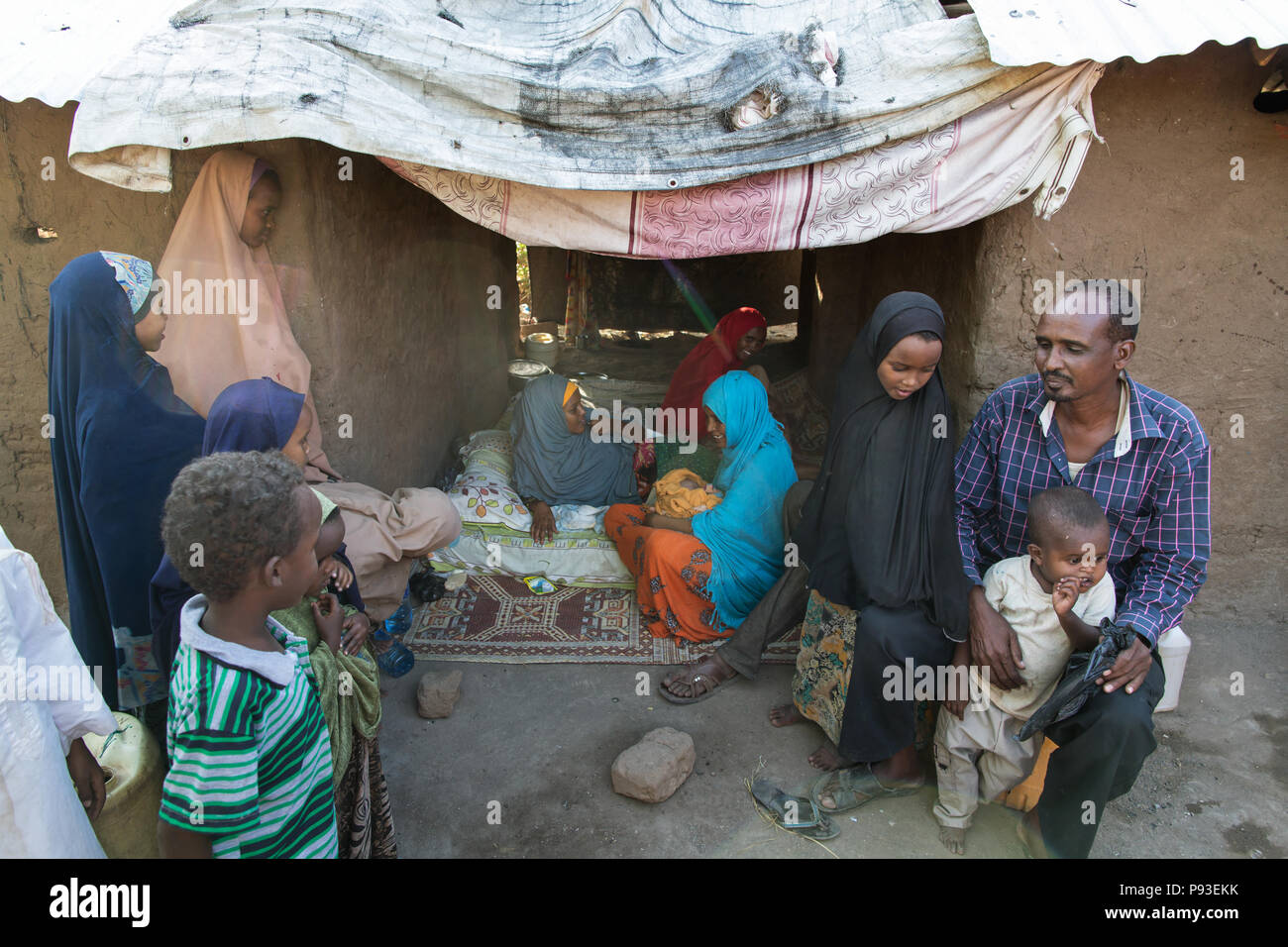 Kakuma, Kenya - refugee family in the refugee camp Kakuma. Visit of relatives and neighbors. Stock Photo