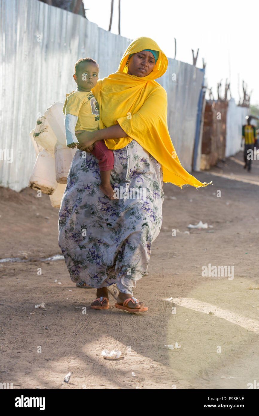Kakuma, Kenya - mother with child on her arm in refugee camp Kakuma. Stock Photo