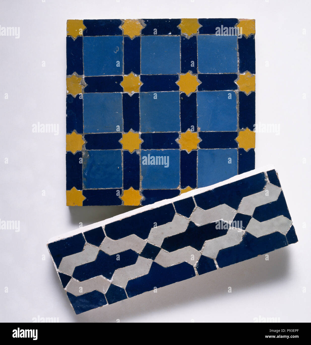 Close-up of old patterned blue and black+white tiles Stock Photo