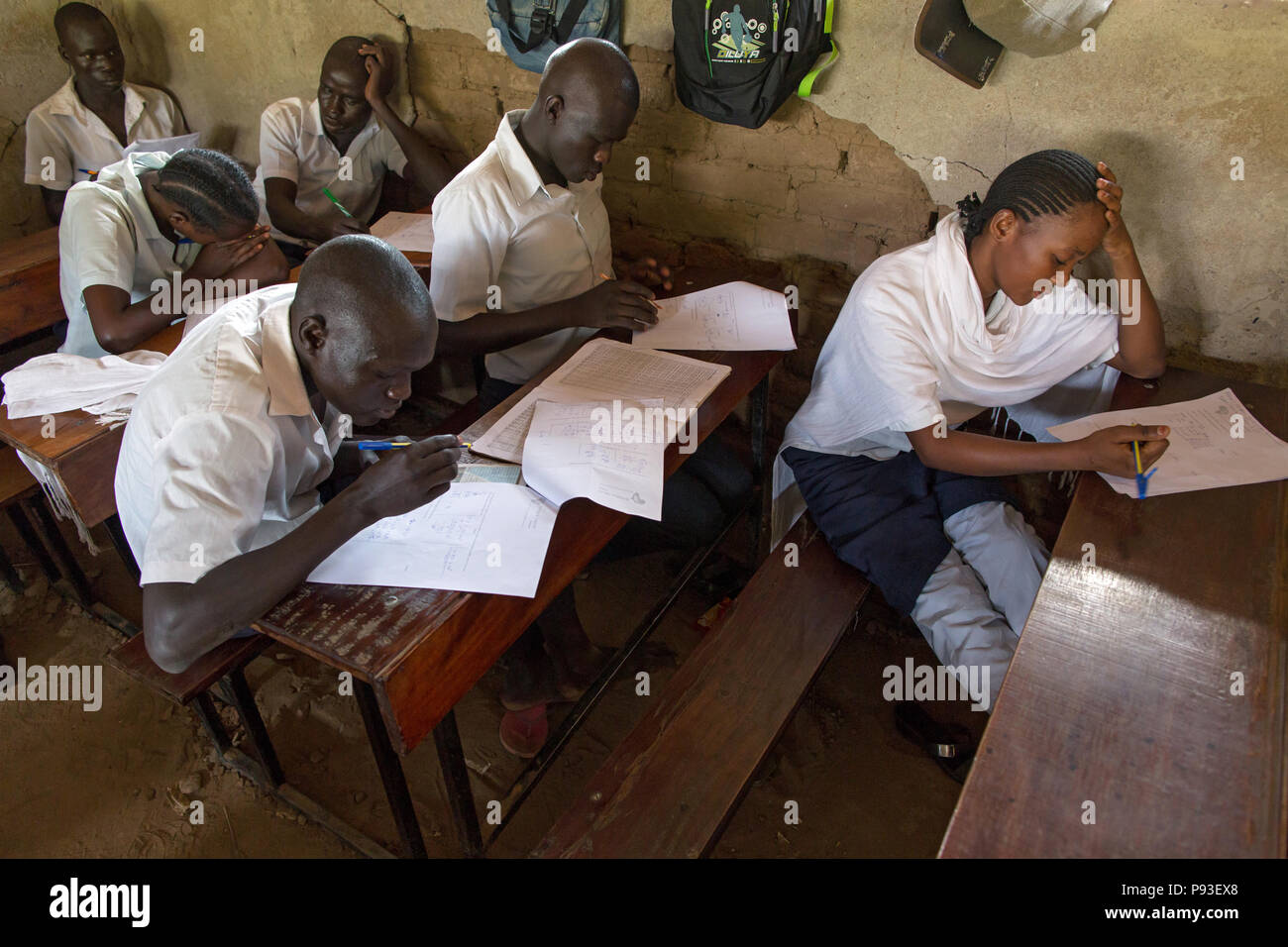 Kakuma, Kenya - Students write exams in a classroom of a school building in the Kakuma refugee camp. Stock Photo