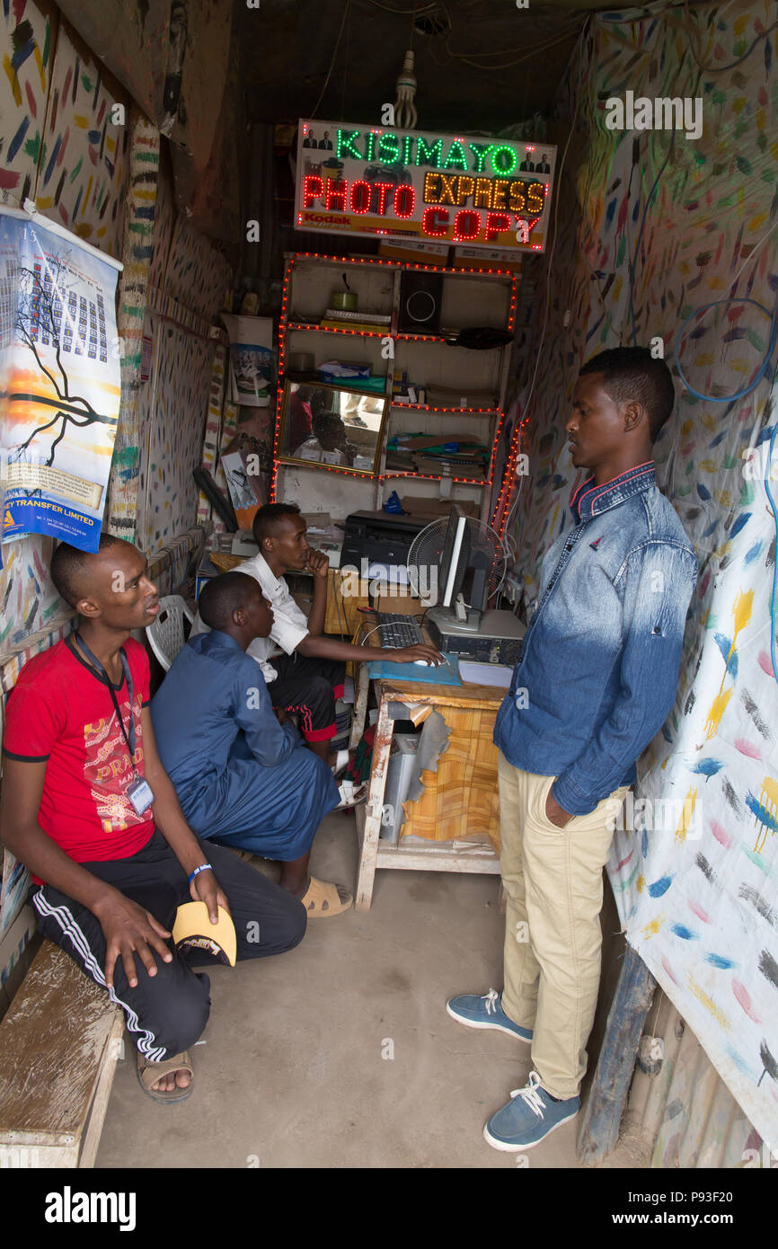 Kakuma, Kenya - Customers are waiting in a small photocopy and internet shop in Kakuma. Stock Photo