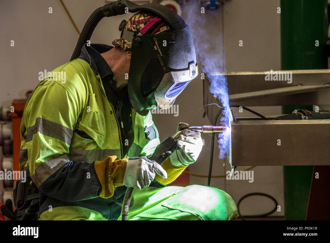 Welder wearing protective equipment welding Stock Photo