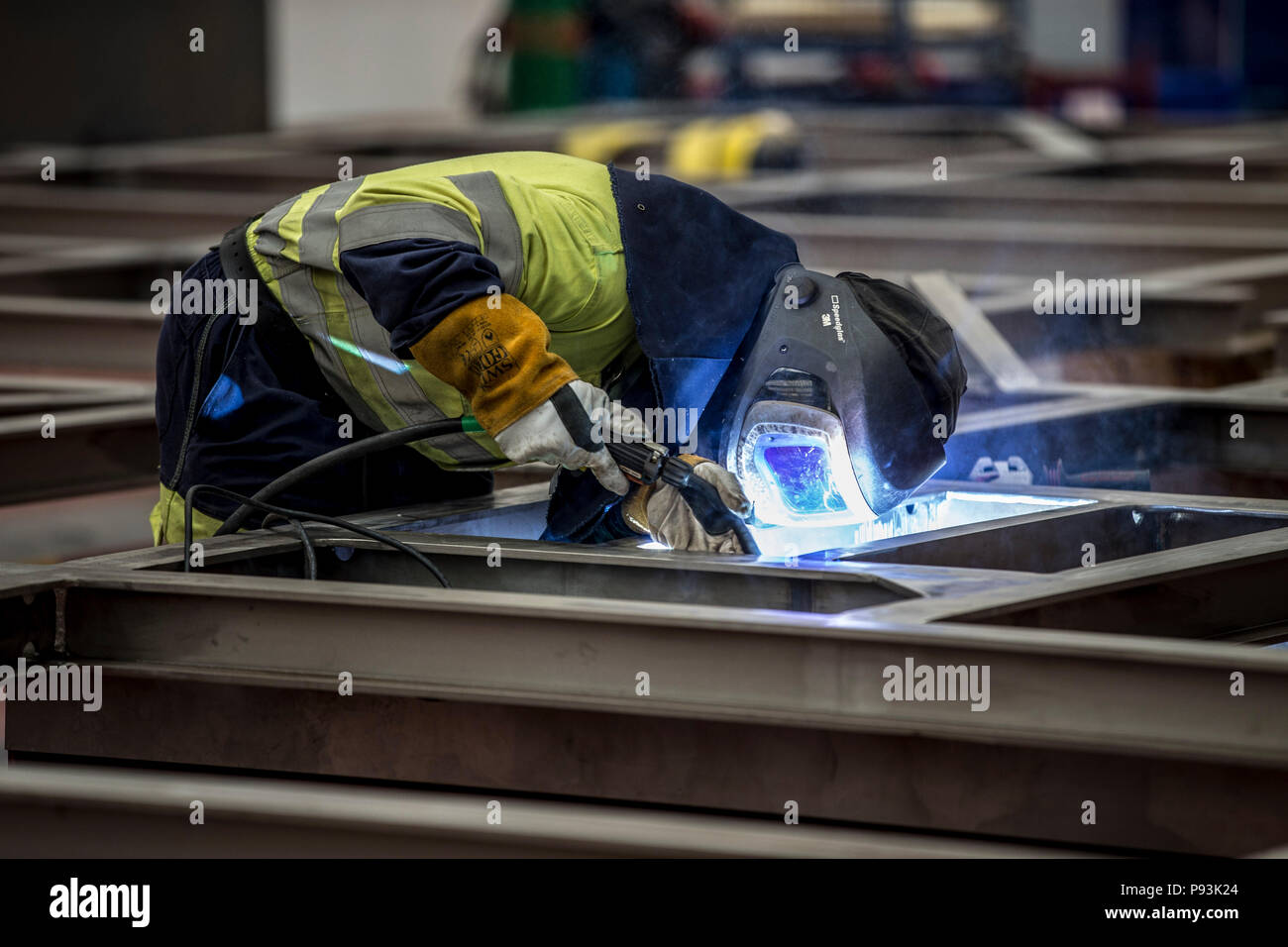 Welder wearing protective equipment welding Stock Photo