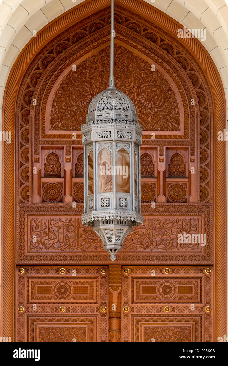 Large wooden door and metal lantern at Sultan Qaboos Grand Mosque in Muscat Oman Stock Photo