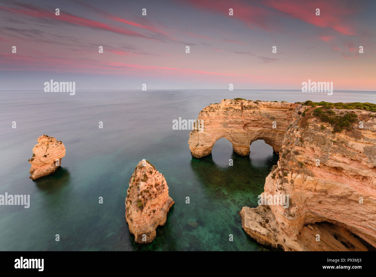 Amazing sunset at Marinha Beach in the Algarve, Portugal. Landscape with strong colors of one of the main holiday destinations in europe. Summer touri Stock Photo
