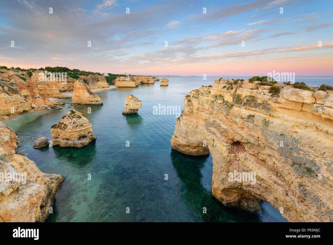 Amazing sunset at Marinha Beach in the Algarve, Portugal. Landscape with strong colors of one of the main holiday destinations in europe. Summer touri Stock Photo