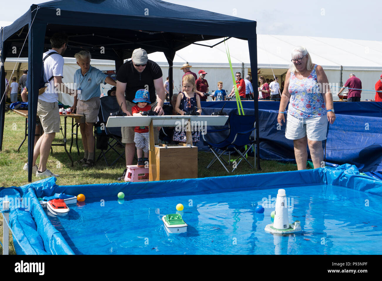 Radio control model boats have a go for kids at Wings and Wheels Stock Photo