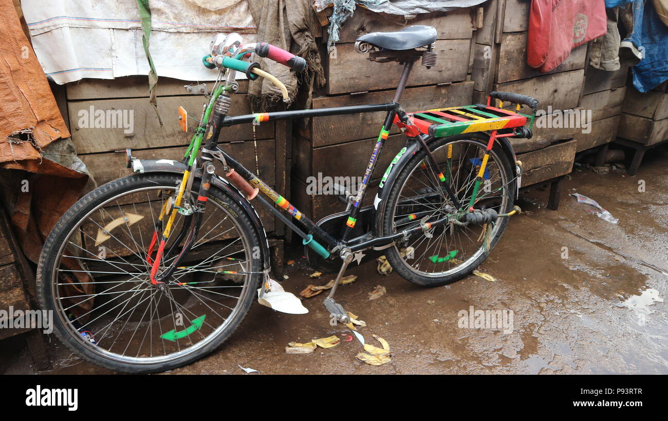 Bicycle leaning against wooden shacks, close up, Goma, Democratic Republic of Congo, Africa Stock Photo