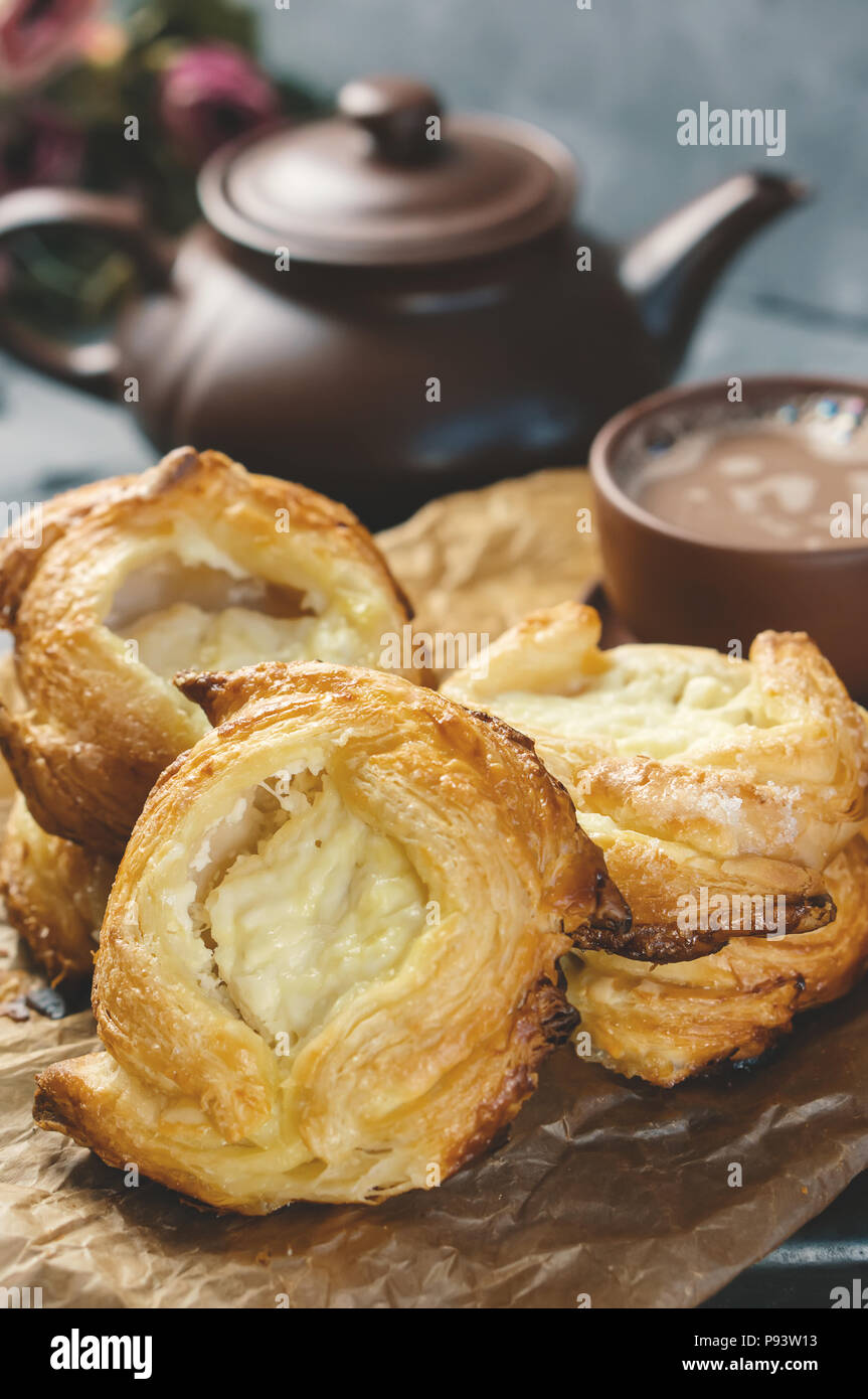 Rolls of puff pastry and cheese, homemade European. Home-made buns for tea. Stock Photo