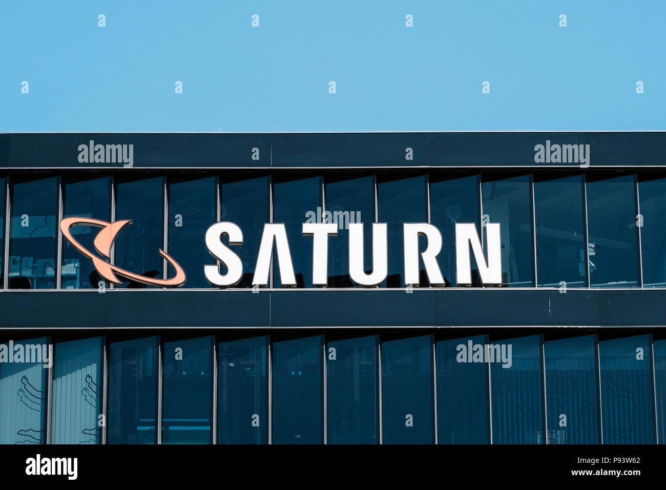 Berlin, Germany - july 2017: The logo of the consumer electronic retail store 'Saturn', in Berlin , Germany Stock Photo