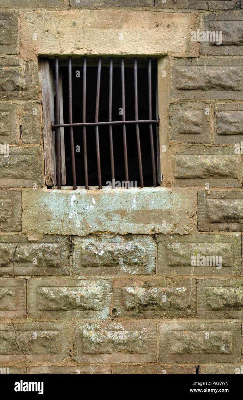 Detail of a barred window in the one-room territorial jail in Texola, Oklahoma. The historic structure is now an attraction in the Route 66 town. Stock Photo